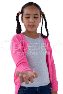 Girl pretending to hold an invisible object