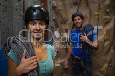 Portrait of athletes in sports helmet carrying ropes at class