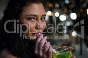 Portrait of beautiful woman drinking mocktail