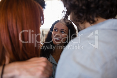 Close up of smiling friends huddling