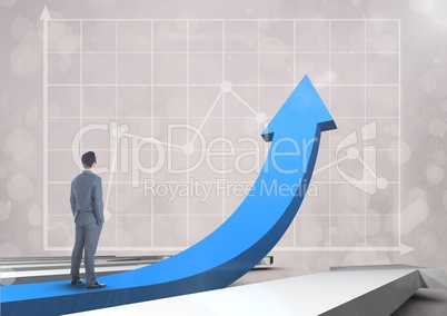 businessman standing on blue arrow