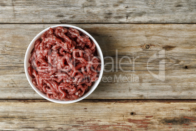 Chopped meat on the wooden background