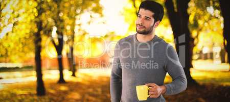 Composite image of thoughtful man holding holding coffee mug
