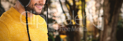 Composite image of smiling man wearing knit hat against white background