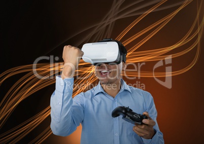 Businessman playing with computer game controller with virtual reality headset with curvy lines back