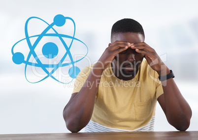Businessman at desk with diagram of science atoms
