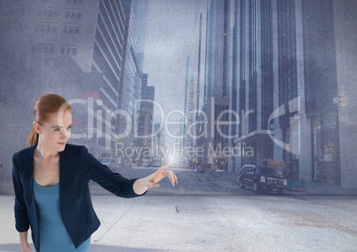 Businesswoman touching sky in tall city