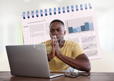 Businessman at desk with laptop and statistics information notepad