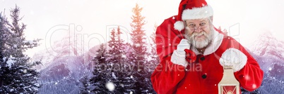 Santa with Winter landscape holding lantern