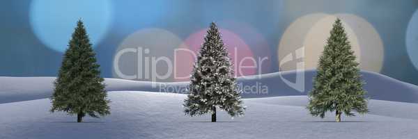 Christmas trees in winter landscape with sparkling bokeh light circles