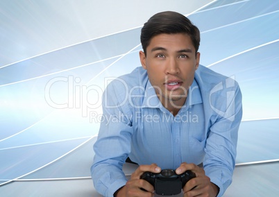 Businessman playing with computer game controller with bright curves background