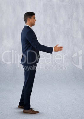 Businessman reaching out for handshake
