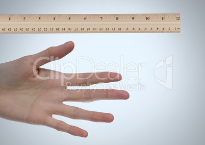 Ruler measuring size of long hand and fingers