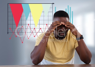 man at desk and statistic charts