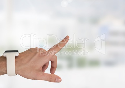 Hand interacting and pointing with bright background and smart watch