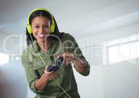 woman playing with computer game controller with bright background