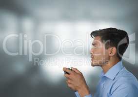 man playing with computer game controller with bright windows background