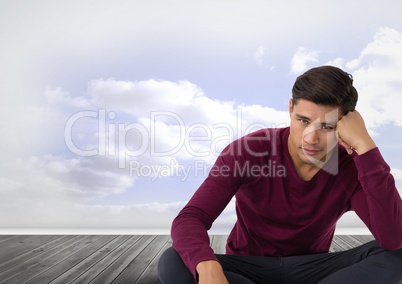 Businessman disappointed and gloomy sitting with clouds