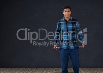 Man holding empty pockets in room