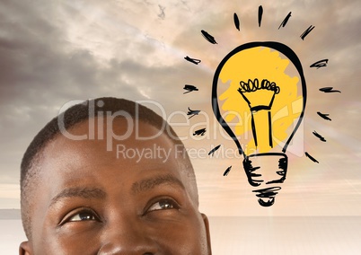 man looking up at light bulb idea