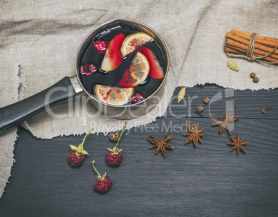 mulled wine in an aluminum ladle