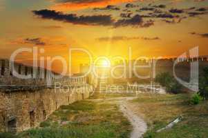 Sunrise over the fortress wall of a medieval fortress. Akkerman