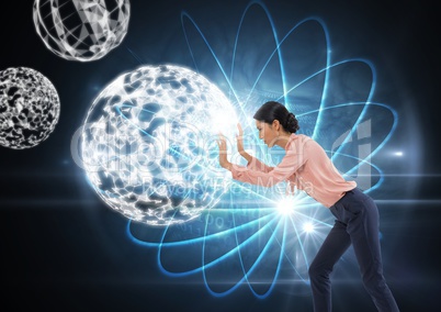 Businesswoman pushing glowing orb spheres