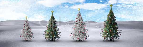 Christmas trees in winter landscape with blue sky