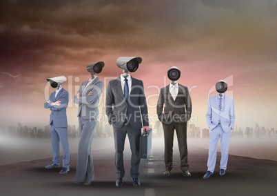 Business people with CCTV head on street