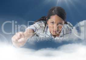 Businesswoman flying in clouds