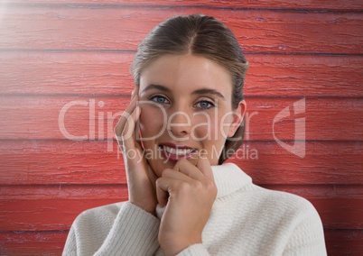 Woman against wood with warm jumper