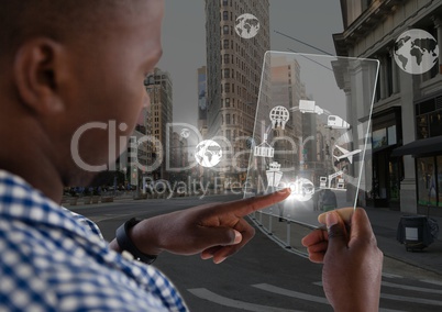 Man holding glass interface, globes
