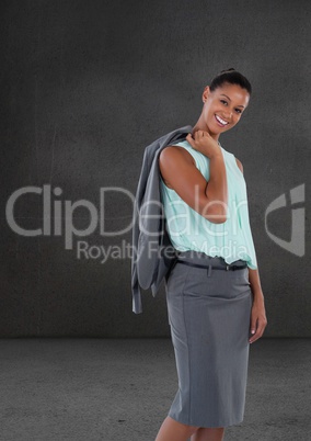 Businesswoman with jacket over shoulder in room