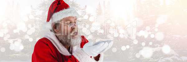 Santa with Winter landscape blowing hands