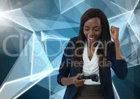 Businesswoman playing with computer game controller with polygons background