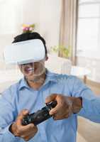 man playing with computer game controller and virtual reality headset with bright background