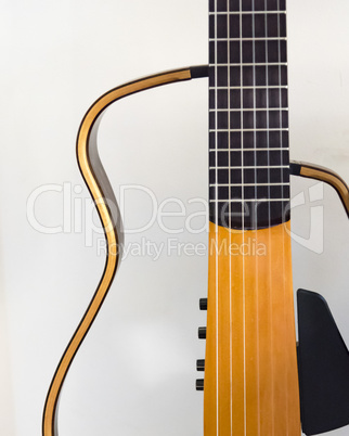 Electric guitar detail, white background.