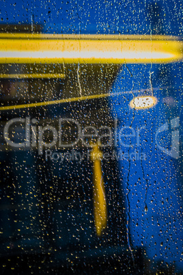 Raindrops on train window.