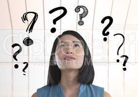 woman looking up at question mark