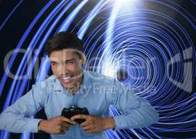 Businessman playing with computer game controller with bright tunnel background
