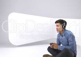Businessman playing with computer game controller with bright white background