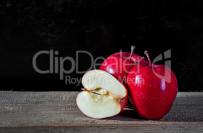 Whole and cut in half apple