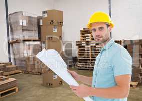 man with boxes in warehouse