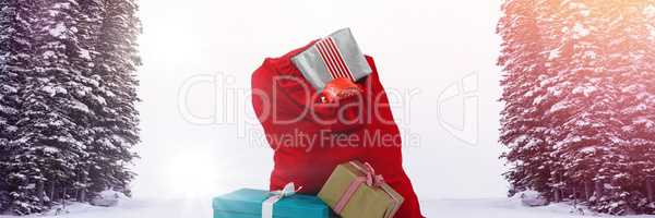 Santa Claus sack of gifts in Winter forest