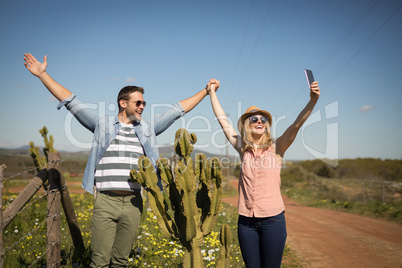 Couple taking selfie with mobile phone