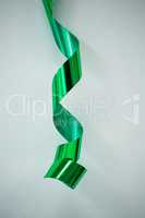 Green streamers on white background