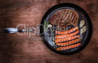 fried piece of beef on a round frying pan