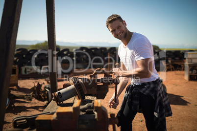 Smiling man working on vintage machine