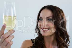 Smiling woman holding glass of champagne
