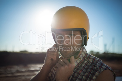 Man wearing a helmet on a sunny day